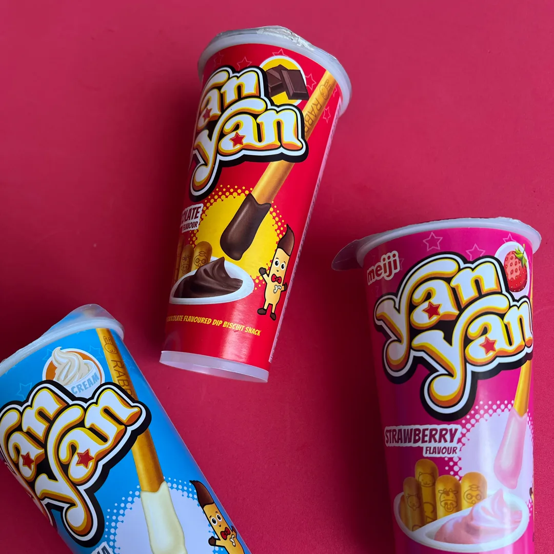 Meiji Yan Yan biscuit snack cups in chocolate, strawberry and cream flavours.